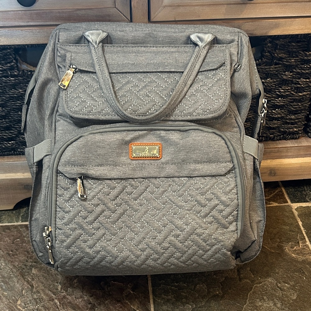Babbleroo Chic Gray Multifunctional Backpack, Diaper Bag with Numerous Pockets.
